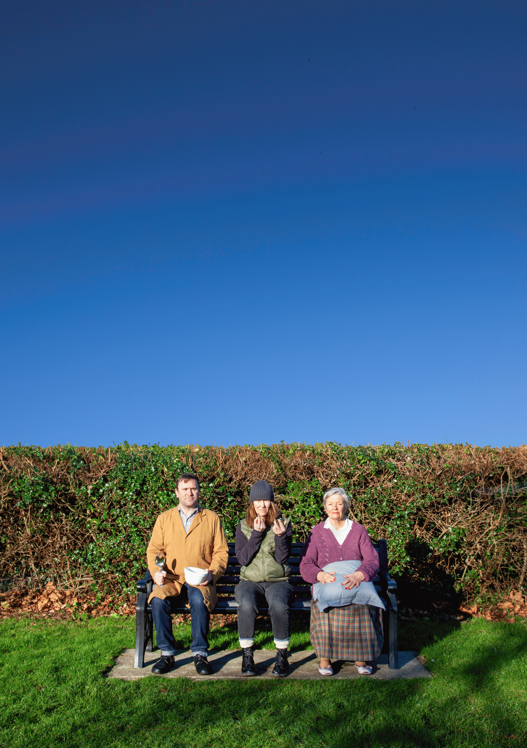 Motherland - 3 people on a bench